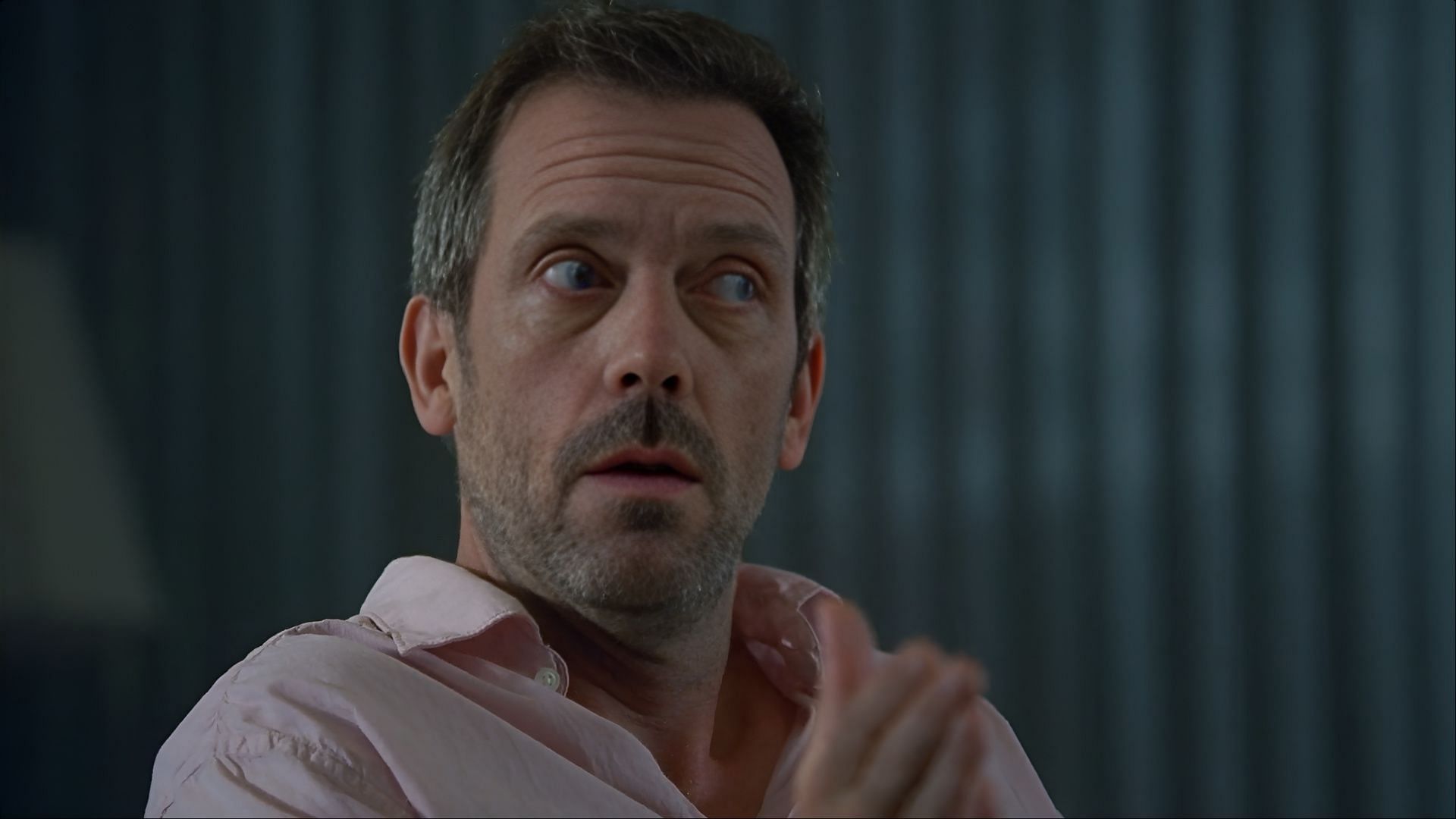 Even in quiet moments, House’s guarded expressions reveal the toll of emotional isolation masked by clinical genius. (Image via Amazon Prime)